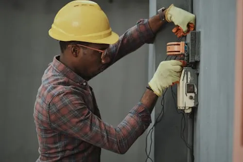 HVAC technician performing professional maintenance on heating system in Belton, TX home